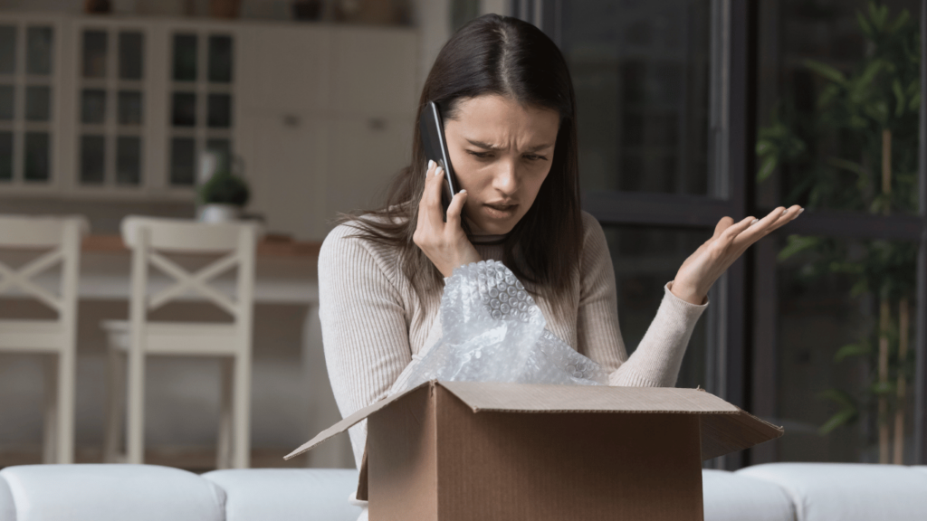 Customer looking frustrated at the way the customer's issue was being handled as well as the time spent waiting for call rerouting or troubleshooting