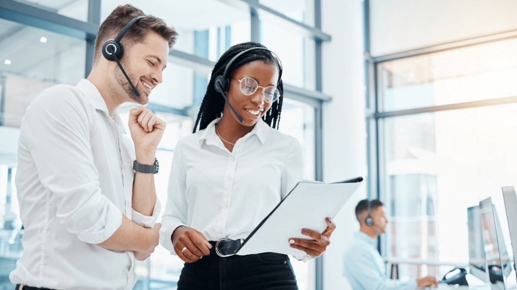 Team leader looking at a customer service qa scorecard during a performance review