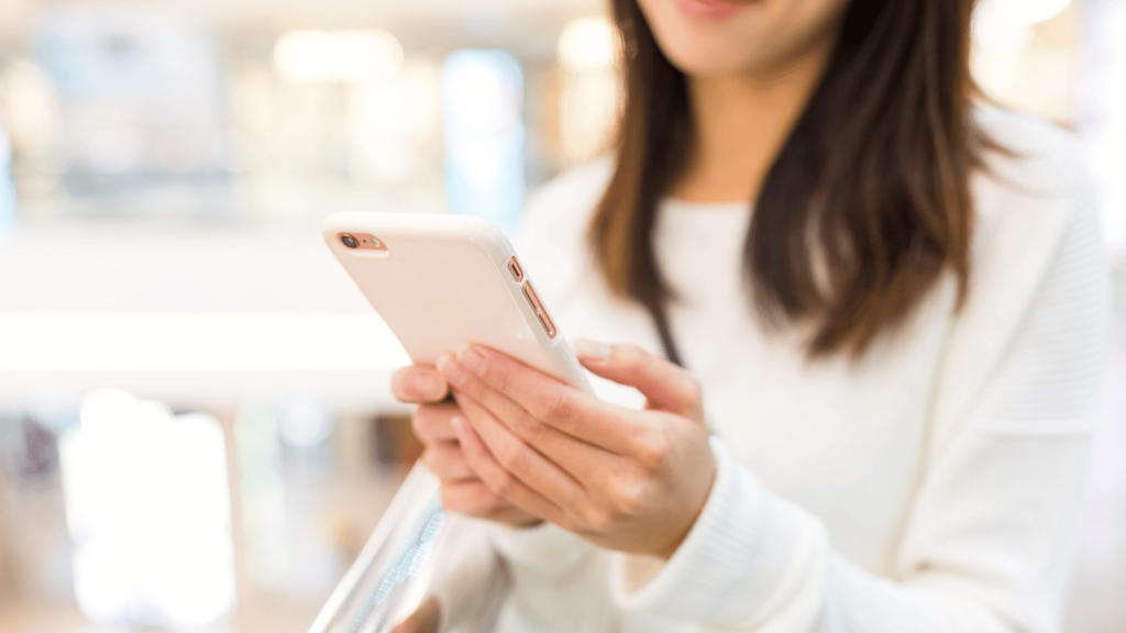 Customer receiving SMS messages via mobile phone