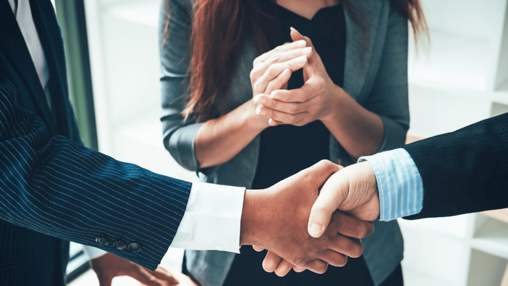 Customer and company representative shaking hands