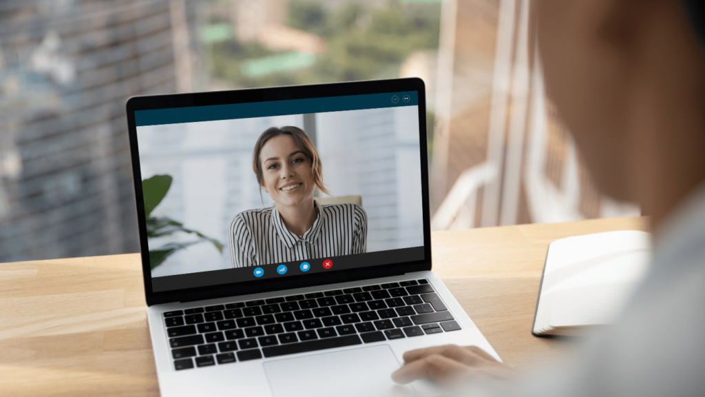 Outsourcing customer service shown through a business owner talking to an outsourced partner over video conferencing