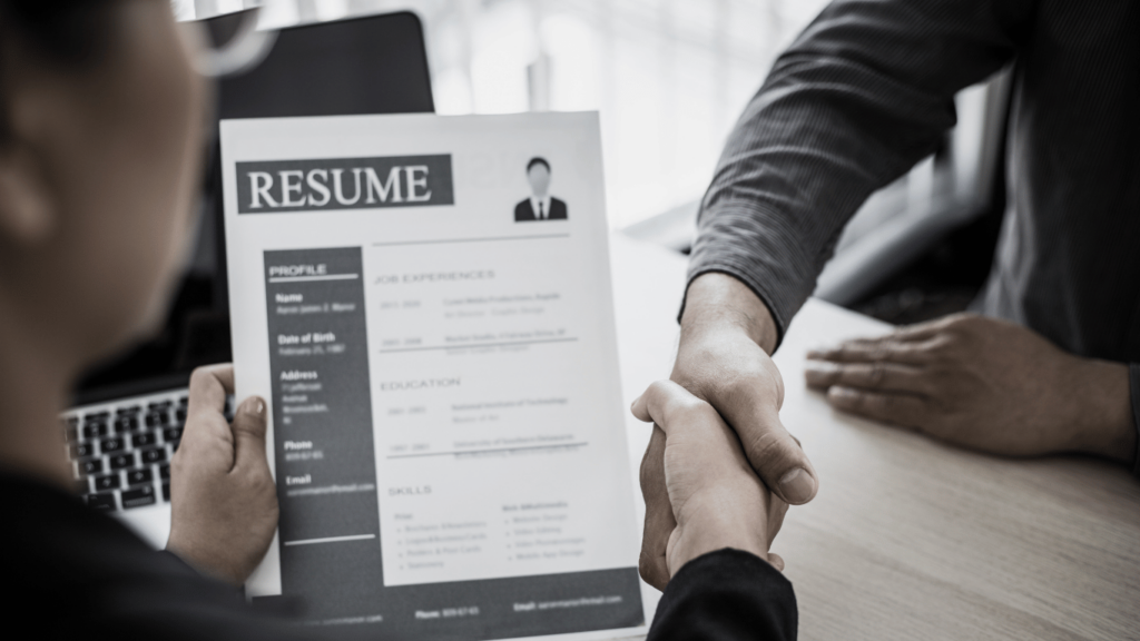 Hiring managers looking at resumes of highly skilled professionals